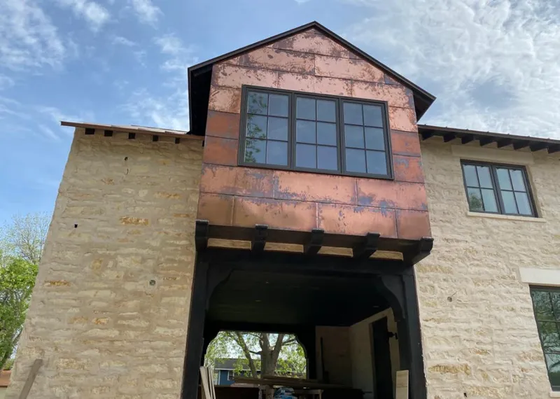 Copper metal panel facade on a stone building for Metal Roof Coating in Morro Bay